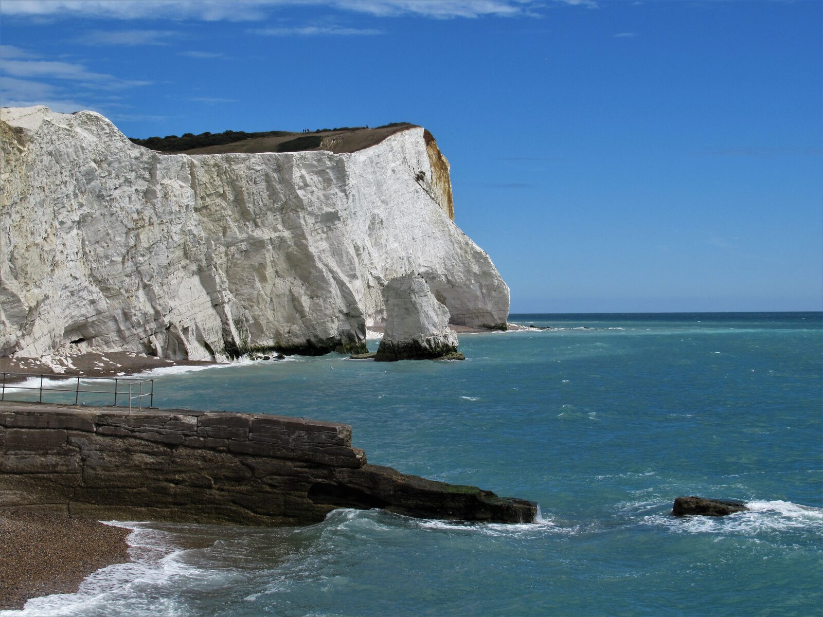 The chalk cliffs of Seaford Head rising above the shingle at the eastern end of Seaford Bay
