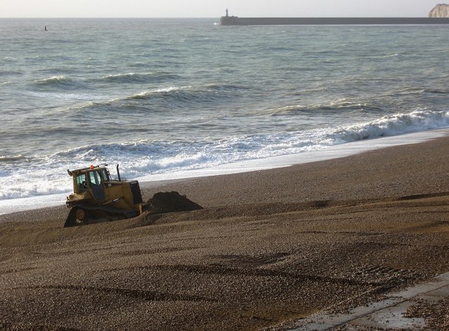 Bulldozers redistributing shingle on Seaford Beach