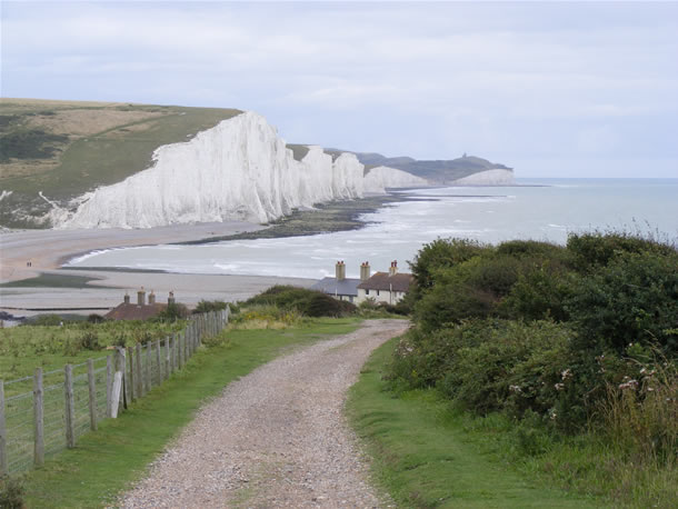 The Seven Sisters chalk cliffs with coastguard cottages at Cuckmere Haven